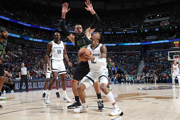 NEW ORLEANS, LA - DECEMBER 19: Ja Morant #12 of the Memphis Grizzlies drives to the basket during the game against the New Orleans Pelicans on December 19, 2023 at the Smoothie King Center in New Orleans, Louisiana. NOTE TO USER: User expressly acknowledges and agrees that, by downloading and or using this Photograph, user is consenting to the terms and conditions of the Getty Images License Agreement. Mandatory Copyright Notice: Copyright 2023 NBAE (Photo by Layne Murdoch Jr./NBAE via Getty Images)