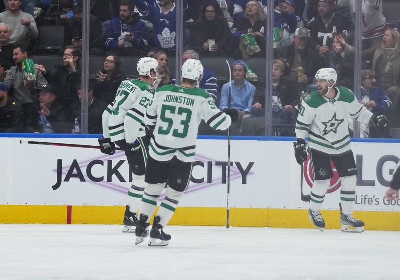 Oct 20, 2022; Toronto, Ontario, CAN; Dallas Stars center Tyler Seguin (91) scores a goal against the Toronto Maple Leafs and celebrates with center Wyatt Johnston (53) and left wing Mason Marchment (27) during the third period at Scotiabank Arena. Mandatory Credit: Nick Turchiaro-USA TODAY Sports