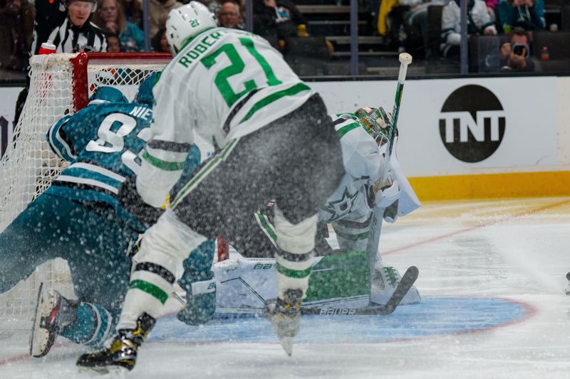 Jan 18, 2023; San Jose, California, USA; San Jose Sharks left wing Matt Nieto (83) attempts to pry the puck into the net after the save by Dallas Stars goaltender Jake Oettinger (29) during the second period at SAP Center at San Jose. Mandatory Credit: Neville E. Guard-USA TODAY Sports