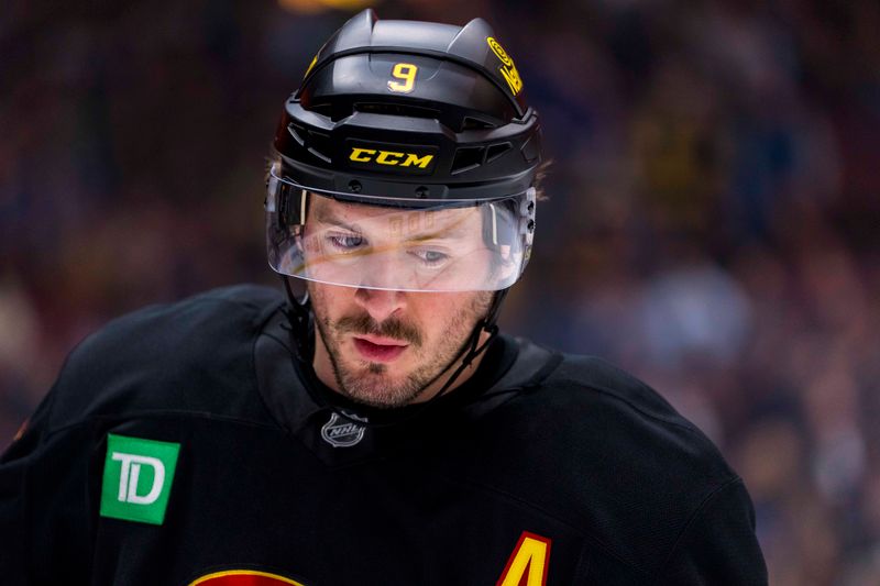 Jan 21, 2025; Vancouver, British Columbia, CAN; Vancouver Canucks forward J.T. Miller (9) during a stop in play against the Buffalo Sabres in the first period at Rogers Arena. Mandatory Credit: Bob Frid-Imagn Images