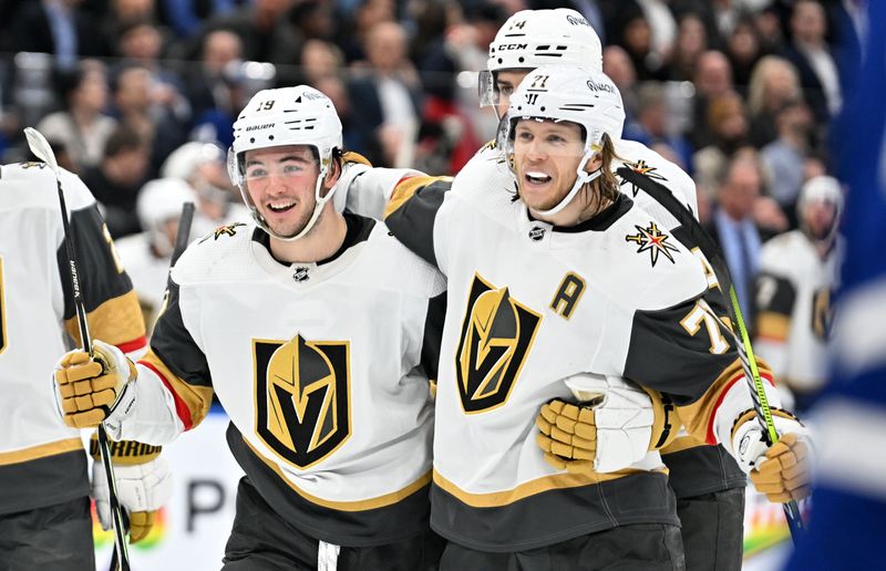 Feb 27, 2024; Toronto, Ontario, CAN;  Vegas Golden Knights forward William Karlsson (71) celebrates with forward Brendan Brisson (19) and defenseman Nicolas Hague (14) after scoring a goal against the Toronto Maple Leafs in the second period at Scotiabank Arena. Mandatory Credit: Dan Hamilton-USA TODAY Sports