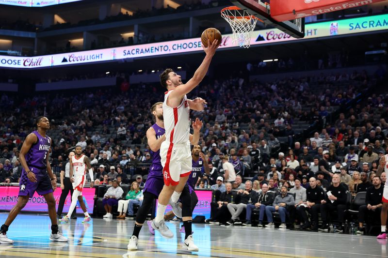 SACRAMENTO, CALIFORNIA - DECEMBER 03: Alperen Sengun #28 of the Houston Rockets goes up or a shot on Domantas Sabonis #11 of the Sacramento Kings in the first half at Golden 1 Center on December 03, 2024 in Sacramento, California. NOTE TO USER: User expressly acknowledges and agrees that, by downloading and/or using this photograph, user is consenting to the terms and conditions of the Getty Images License Agreement.   (Photo by Ezra Shaw/Getty Images)