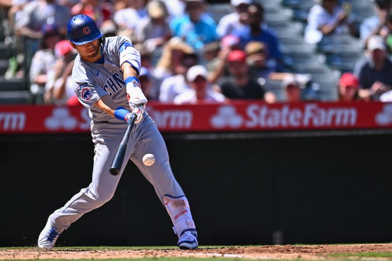 Aug 24, 2025; Anaheim, California, USA; Chicago Cubs designated hitter Seiya Suzuki (27) singles against the Los Angeles Angels during the fifth inning at Angel Stadium. Mandatory Credit: Jonathan Hui-Imagn Images Aug 24, 2025; Anaheim, California, USA; Chicago Cubs designated hitter Seiya Suzuki (27) singles against the Los Angeles Angels during the fifth inning at Angel Stadium. Mandatory Credit: Jonathan Hui-Imagn Images