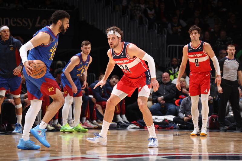 WASHINGTON, DC -? JANUARY 21: Corey Kispert #24 of the Washington Wizards plays defense during the game  against Jamal Murray #27 of the Denver Nuggets on January 21, 2024 at Capital One Arena in Washington, DC. NOTE TO USER: User expressly acknowledges and agrees that, by downloading and or using this Photograph, user is consenting to the terms and conditions of the Getty Images License Agreement. Mandatory Copyright Notice: Copyright 2024 NBAE (Photo by Stephen Gosling/NBAE via Getty Images)