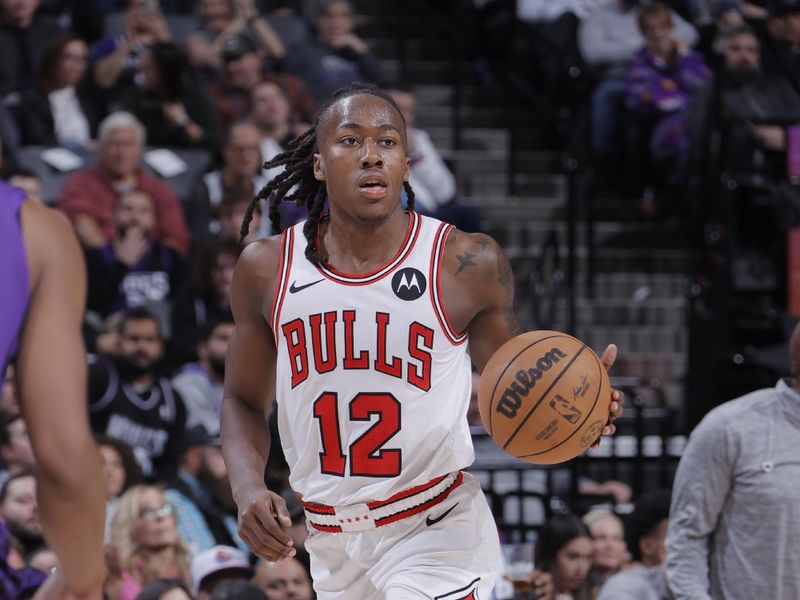 SACRAMENTO, CA - MARCH 4:  Ayo Dosunmu #12 of the Chicago Bulls handles the ball during the game against the Sacramento Kings on March 4, 2024 at Golden 1 Center in Sacramento, California. NOTE TO USER: User expressly acknowledges and agrees that, by downloading and or using this Photograph, user is consenting to the terms and conditions of the Getty Images License Agreement. Mandatory Copyright Notice: Copyright 2024 NBAE (Photo by Rocky Widner/NBAE via Getty Images)