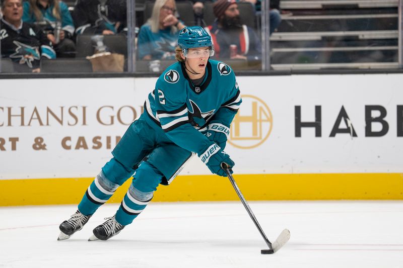 Oct 1, 2024; San Jose, California, USA;  San Jose Sharks center Will Smith (2) controls the puck during the first period against the Utah Hockey Club at SAP Center at San Jose. Mandatory Credit: Stan Szeto-Imagn Images
