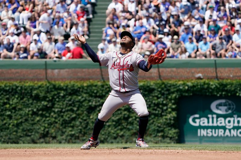 May 23, 2024; Chicago, Illinois, USA; Atlanta Braves second base Ozzie Albies (1) loses the ball in sun against the Chicago Cubs during the third inning at Wrigley Field. Mandatory Credit: David Banks-USA TODAY Sports