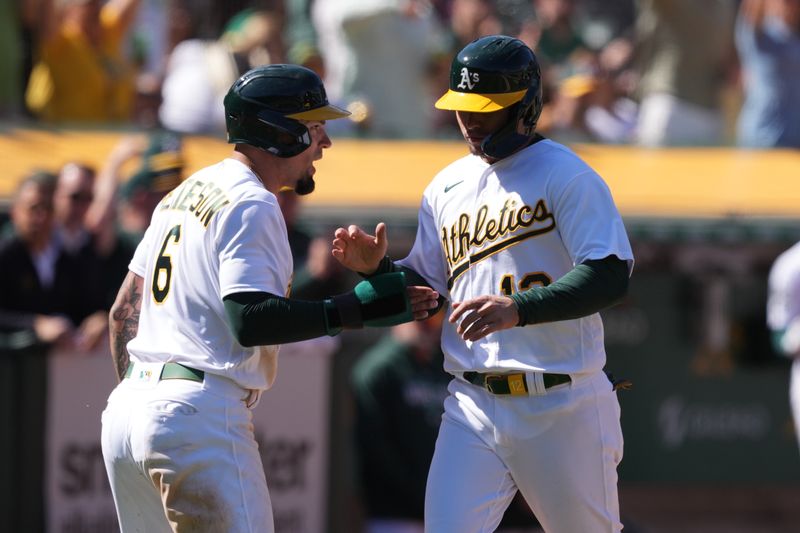 Apr 16, 2023; Oakland, California, USA; Oakland Athletics third baseman Jace Peterson (6) and second baseman Aledmys Diaz (right) celebrate after scoring runs against the New York Mets during the eighth inning at RingCentral Coliseum. Mandatory Credit: Darren Yamashita-USA TODAY Sports