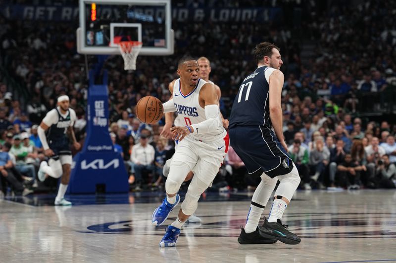 DALLAS, TX - APRIL 28: Russell Westbrook #0 of the LA Clippers handles the ball during the game against the Dallas Mavericks during Round 1 Game 4 of the 2024NBA Playoffs on April 28, 2024 at the American Airlines Center in Dallas, Texas. NOTE TO USER: User expressly acknowledges and agrees that, by downloading and or using this photograph, User is consenting to the terms and conditions of the Getty Images License Agreement. Mandatory Copyright Notice: Copyright 2024 NBAE (Photo by Glenn James/NBAE via Getty Images)