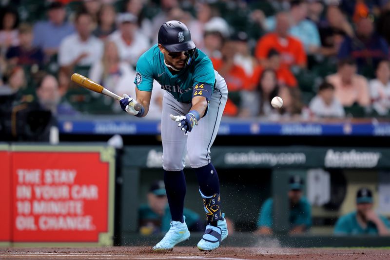 May 4, 2024; Houston, Texas, USA; Seattle Mariners center fielder Julio Rodriguez (44) is hit by a pitch delivered by Houston Astros starting pitcher Framber Valdez (59) during the first inning at Minute Maid Park. Mandatory Credit: Erik Williams-USA TODAY Sports