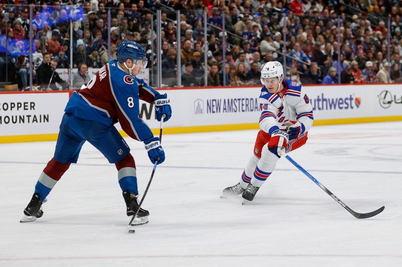 Nov 20, 2025; Denver, Colorado, USA; Colorado Avalanche defenseman Cale Makar (8) passes the puck as New York Rangers center Adam Edstrom (84) defends in the first period at Ball Arena. Mandatory Credit: Isaiah J. Downing-Imagn Images