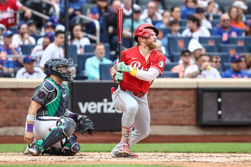 Sep 7, 2024; New York City, New York, USA;  Cincinnati Reds right fielder Jake Fraley (27) hits a single in the third inning against the New York Mets at Citi Field. Mandatory Credit: Wendell Cruz-Imagn Images