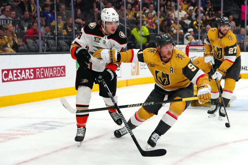 Apr 18, 2024; Las Vegas, Nevada, USA; Anaheim Ducks right wing Troy Terry (19) skates against Vegas Golden Knights center Jack Eichel (9) during the first period at T-Mobile Arena. Mandatory Credit: Stephen R. Sylvanie-USA TODAY Sports