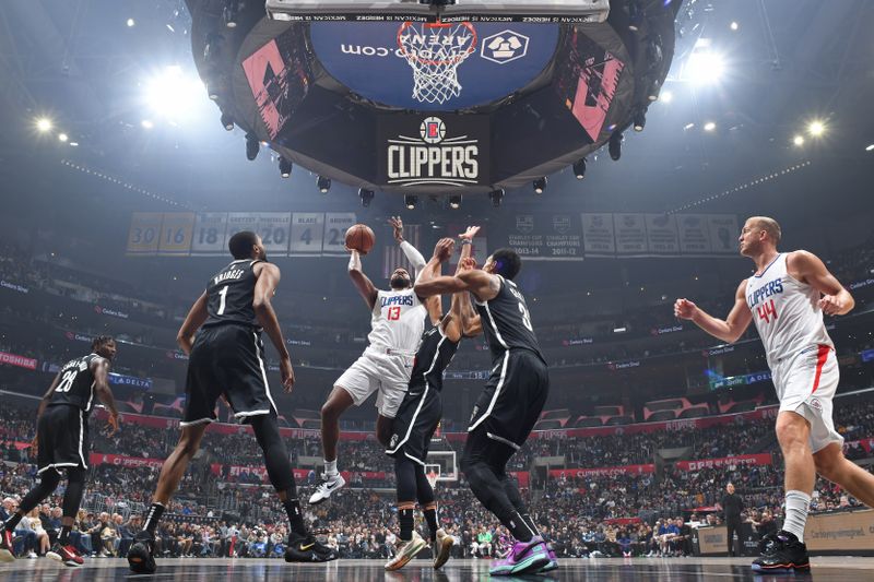 LOS ANGELES, CA - JANUARY 21: Paul George #13 of the LA Clippers drives to the basket during the game against the Brooklyn Nets on January 21, 2024 at Crypto.Com Arena in Los Angeles, California. NOTE TO USER: User expressly acknowledges and agrees that, by downloading and/or using this Photograph, user is consenting to the terms and conditions of the Getty Images License Agreement. Mandatory Copyright Notice: Copyright 2024 NBAE (Photo by Adam Pantozzi/NBAE via Getty Images)