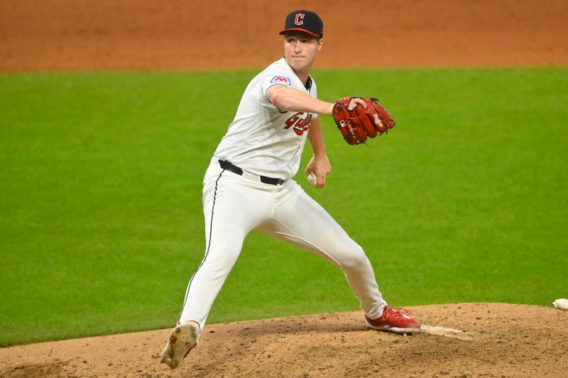 Aug 14, 2024; Cleveland, Ohio, USA; Cleveland Guardians relief pitcher Tim Herrin (29) delivers a pitch in the eighth inning against the Chicago Cubs at Progressive Field. Mandatory Credit: David Richard-USA TODAY Sports