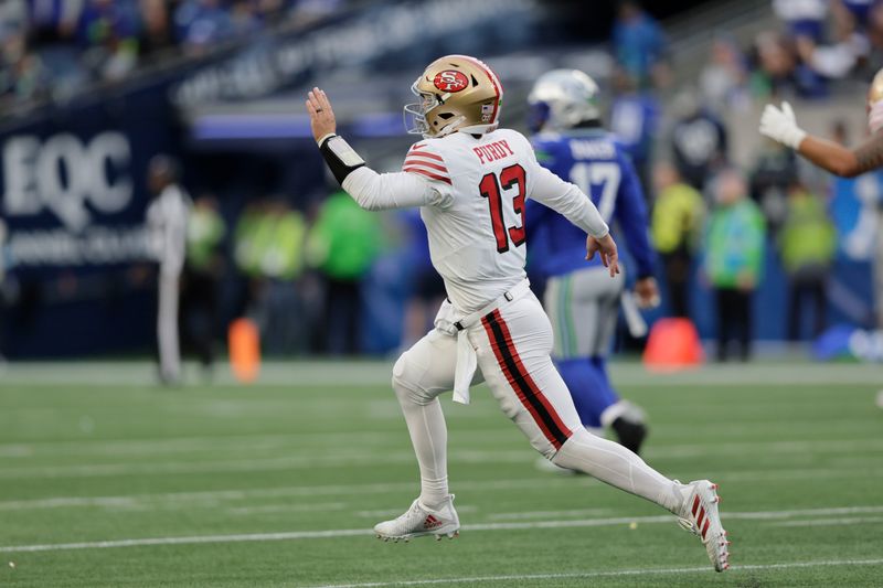 San Francisco 49ers quarterback Brock Purdy (13) react during the first half of an NFL football game against the Seattle Seahawks, Thursday, Oct. 10, 2024, in Seattle. (AP Photo/John Froschauer)