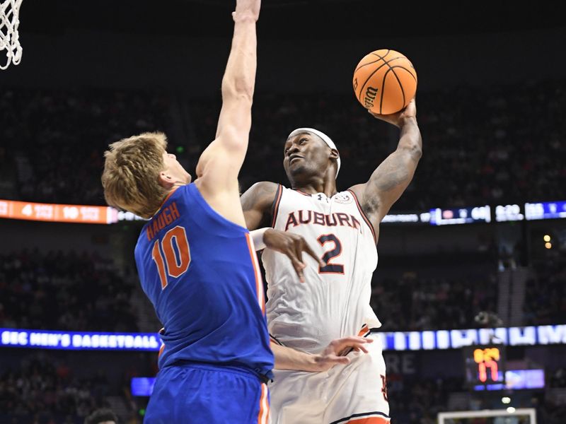 Mar 17, 2024; Nashville, TN, USA;  Auburn Tigers forward Jaylin Williams (2) shoots against Florida Gators forward Thomas Haugh (10) in the second half in the SEC Tournament championship game at Bridgestone Arena. Mandatory Credit: Steve Roberts-USA TODAY Sports