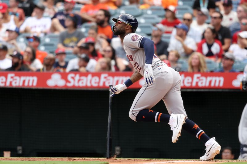 Sep 15, 2024; Anaheim, California, USA;  Houston Astros left fielder Jason Heyward (22) hits a home run during the third inning against the Los Angeles Angels at Angel Stadium. Mandatory Credit: Kiyoshi Mio-Imagn Images