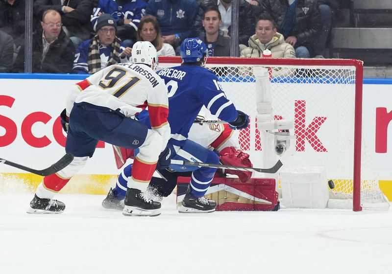 Nov 28, 2023; Toronto, Ontario, CAN; Toronto Maple Leafs center Noah Gregor (18) scores a goal against the Florida Panthers during the second period at Scotiabank Arena. Mandatory Credit: Nick Turchiaro-USA TODAY Sports