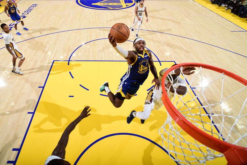 SAN FRANCISCO, CA - OCTOBER 30: Buddy Hield #7 of the Golden State Warriors drives to the basket during the game against the New Orleans Pelicans on October 30, 2024 at Chase Center in San Francisco, California. NOTE TO USER: User expressly acknowledges and agrees that, by downloading and or using this photograph, user is consenting to the terms and conditions of Getty Images License Agreement. Mandatory Copyright Notice: Copyright 2024 NBAE (Photo by Garrett Ellwood/NBAE via Getty Images)