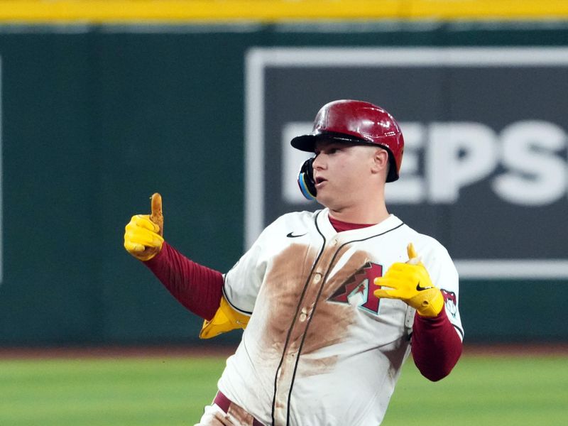 Jul 13, 2024; Phoenix, Arizona, USA; Arizona Diamondbacks designated hitter Joc Pederson (3) reacts after hitting an RBI double against the Toronto Blue Jays during the first inning at Chase Field. Mandatory Credit: Joe Camporeale-USA TODAY Sports