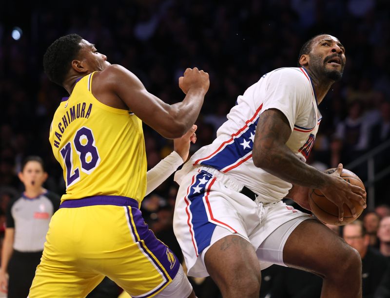 LOS ANGELES, CALIFORNIA - NOVEMBER 08: Andre Drummond #5 of the Philadelphia 76ers looks up to shoot in front of Rui Hachimura #28 of the Los Angeles Lakers during the first half at Crypto.com Arena on November 08, 2024 in Los Angeles, California. (Photo by Harry How/Getty Images) NOTE TO USER: User expressly acknowledges and agrees that, by downloading and/or using this Photograph, user is consenting to the terms and conditions of the Getty Images License Agreement. (Photo by Harry How/Getty Images)