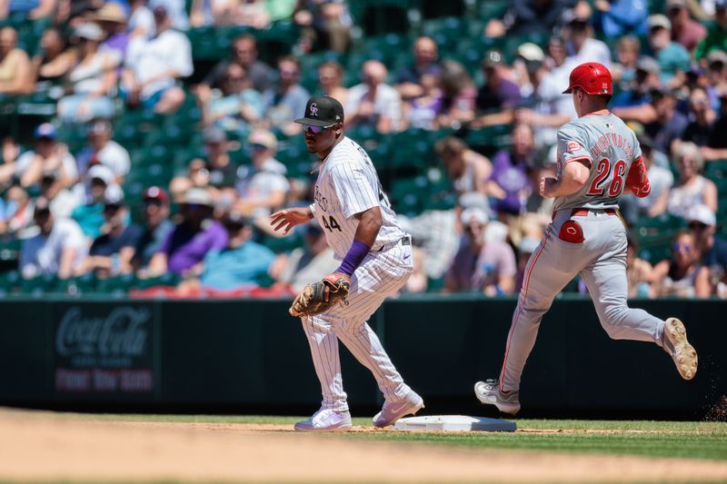 Jun 5, 2024; Denver, Colorado, USA; Colorado Rockies first base Elehuris Montero (44) catches a ball for an out during the fourth inning against the Cincinnati Reds at Coors Field. Mandatory Credit: Andrew Wevers-USA TODAY Sports
