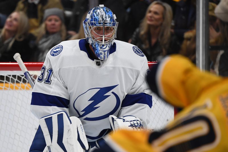 Dec 3, 2023; Nashville, Tennessee, USA;Tampa Bay Lightning goaltender Jonas Johansson (31) waits for a face-off during the first period against the Nashville Predators at Bridgestone Arena. Mandatory Credit: Christopher Hanewinckel-USA TODAY Sports