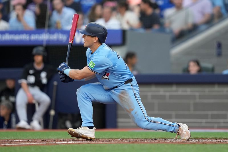 May 22, 2024; Toronto, Ontario, CAN; Toronto Blue Jays center fielder Daulton Varsho (25) hits a two-run triple against the Chicago White Sox during the second inning at Rogers Centre. Mandatory Credit: John E. Sokolowski-USA TODAY Sports