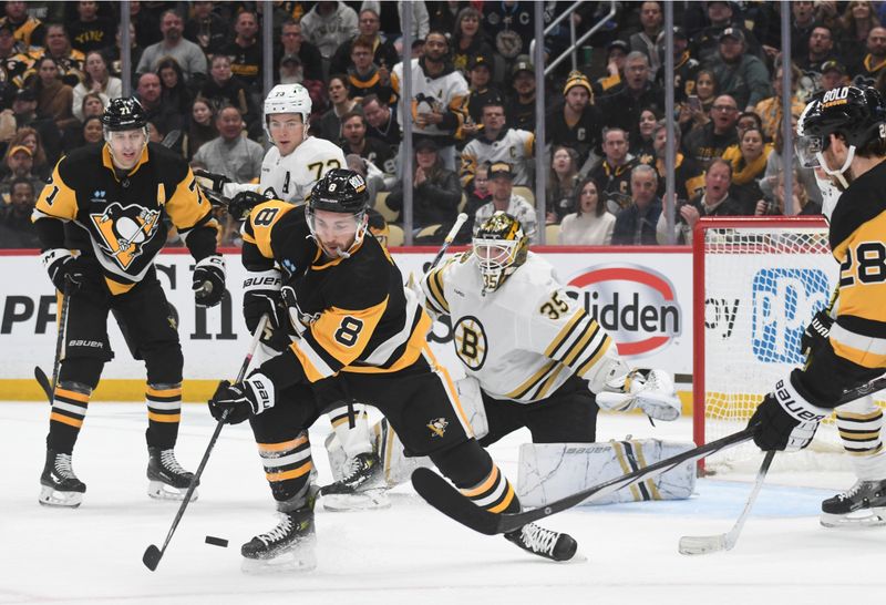 Apr 13, 2024; Pittsburgh, Pennsylvania, USA; Pittsburgh Penguins left wing Michael Bunting (8) plays the puck in front of  Boston Bruins goalie Linus Ullmark (35)  during the first period at PPG Paints Arena. Mandatory Credit: Philip G. Pavely-USA TODAY Sports