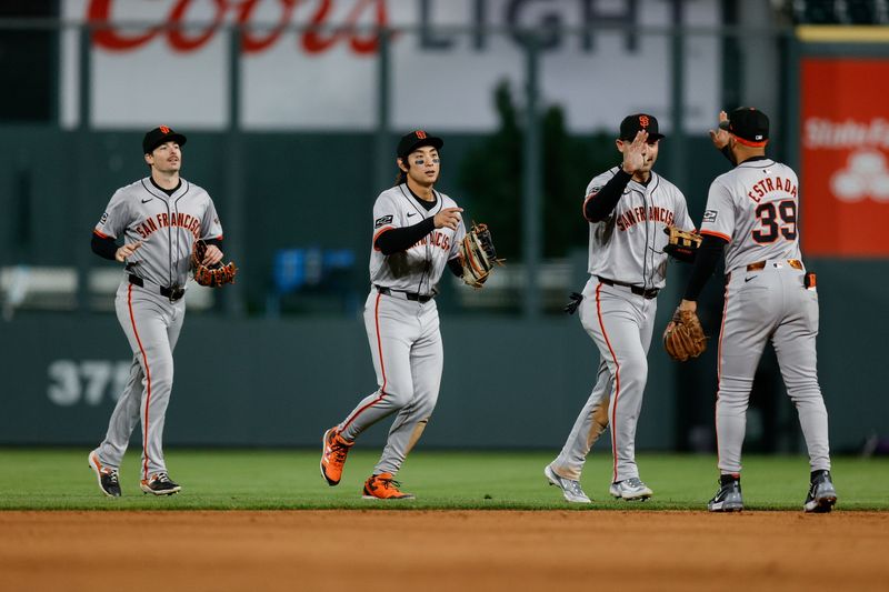 May 7, 2024; Denver, Colorado, USA; San Francisco Giants left fielder Michael Conforto (8) and center fielder Jung Hoo Lee (51) and right fielder Mike Yastrzemski (5) celebrate with second baseman Thairo Estrada (39) after the game against the Colorado Rockies at Coors Field. Mandatory Credit: Isaiah J. Downing-USA TODAY Sports