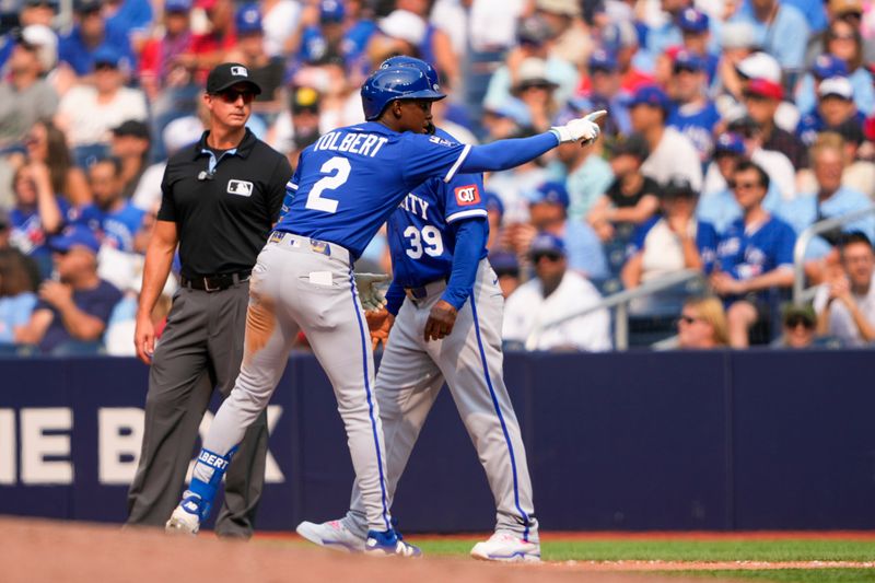 Aug 3, 2025; Toronto, Ontario, CAN; Kansas City Royals second base Tyler Tolbert (2) celebrates hitting a single against the Toronto Blue Jays during the tenth inning at Rogers Centre. Mandatory Credit: Kevin Sousa-Imagn Images