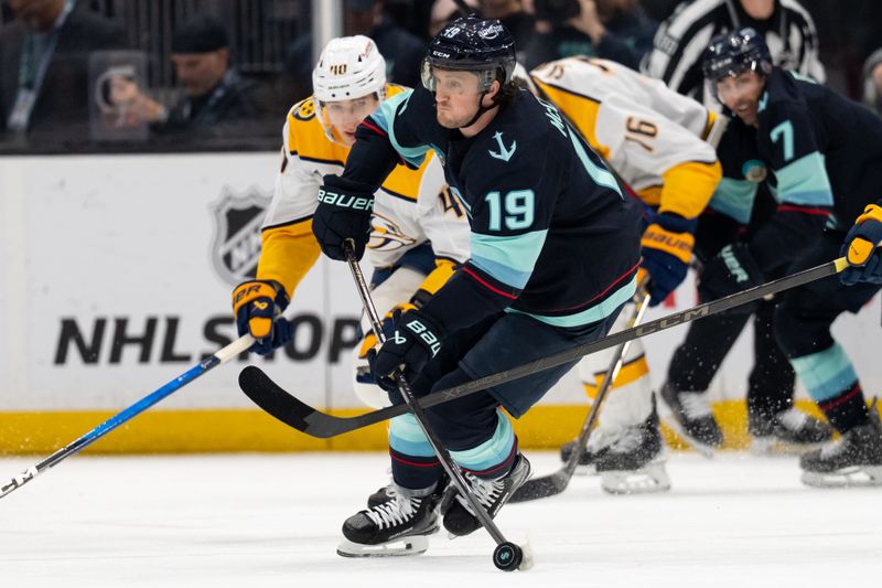 Mar 10, 2026; Seattle, Washington, USA; Seattle Kraken forward Jared McCann (19) skates against Nashville Predators forward Fedor Svechkov (40) during the first period at Climate Pledge Arena. Mandatory Credit: Stephen Brashear-Imagn Images