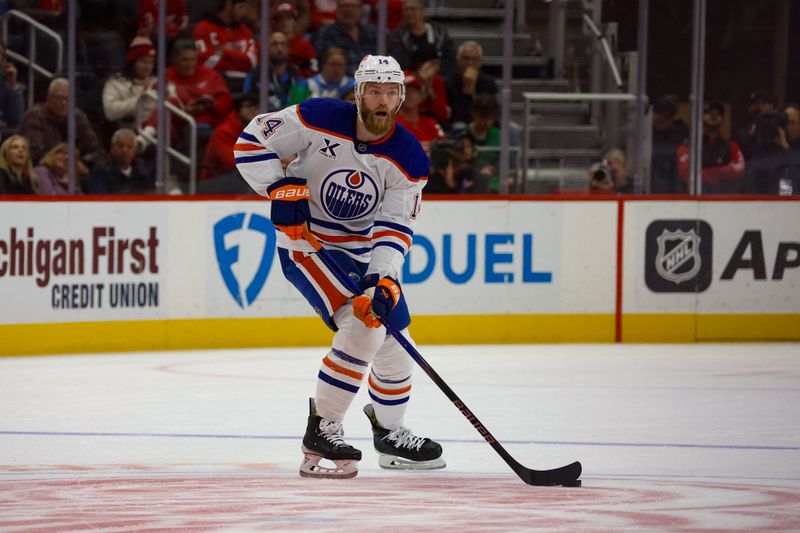 Oct 27, 2024; Detroit, Michigan, USA; Edmonton Oilers defenseman Mattias Ekholm (14) handles the puck during the first period of the game against the Detroit Red Wings at Little Caesars Arena. Mandatory Credit: Brian Bradshaw Sevald-Imagn Images