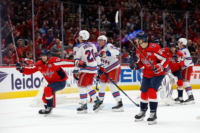 Oct 29, 2024; Washington, District of Columbia, USA; Washington Capitals center Connor McMichael (24) celebrates after scoring a goal against the New York Rangers in the first period at Capital One Arena. Mandatory Credit: Geoff Burke-Imagn Images