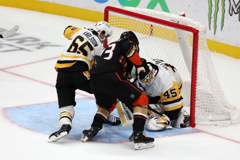 Nov 7, 2023; Anaheim, California, USA; Pittsburgh Penguins goaltender Magnus Hellberg (45) defends the goal against Anaheim Ducks center Mason McTavish (23) during the third period at Honda Center. Mandatory Credit: Kiyoshi Mio-USA TODAY Sports