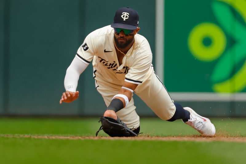 Aug 14, 2024; Minneapolis, Minnesota, USA; Minnesota Twins shortstop Willi Castro (50) catches a line drive by Kansas City Royals catcher Freddy Fermin (not pictured) in the sixth inning at Target Field. Mandatory Credit: Bruce Kluckhohn-USA TODAY Sports