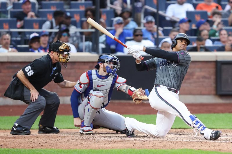 Sep 13, 2025; New York City, New York, USA;  New York Mets right fielder Juan Soto (22) hits a solo home run in the seventh inning against the Texas Rangers at Citi Field. Mandatory Credit: Wendell Cruz-Imagn Images