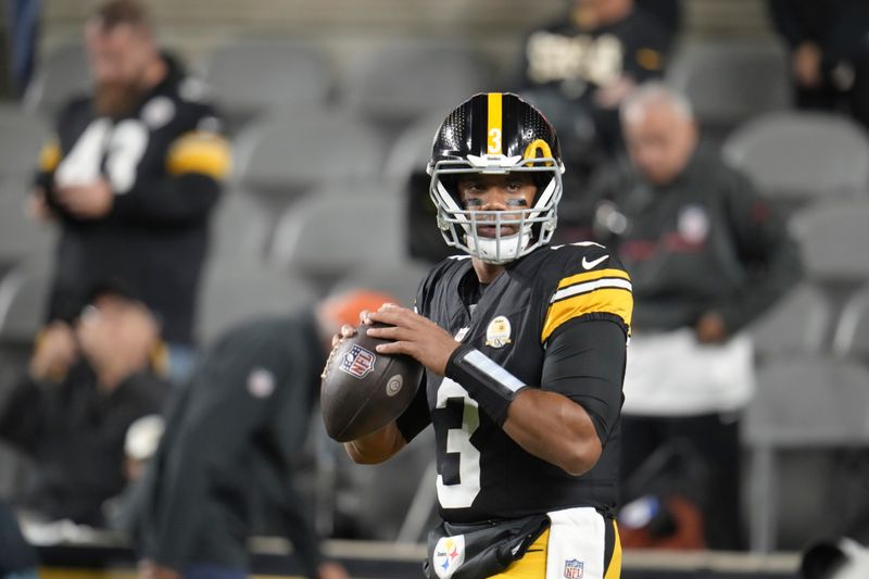 Pittsburgh Steelers quarterback Russell Wilson (3) warms up before an NFL football game against the New York Jets in Pittsburgh, Sunday, Oct. 20, 2024. (AP Photo/Gene J. Puskar)