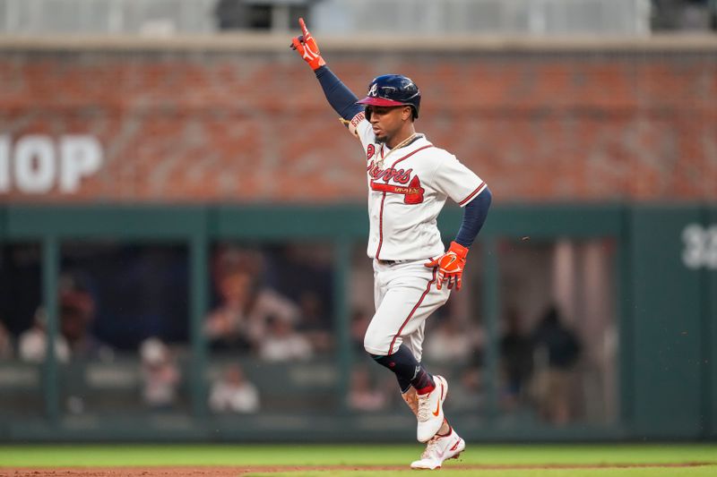 Sep 27, 2023; Cumberland, Georgia, USA; Atlanta Braves second baseman Ozzie Albies (1) reacts after hitting a home run against the Chicago Cubs during the first inning at Truist Park. Mandatory Credit: Dale Zanine-USA TODAY Sports