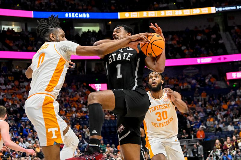 Mar 15, 2024; Nashville, TN, USA; Tennessee Volunteers forward Jonas Aidoo (0) swipes the ball from Mississippi State Bulldogs forward Tolu Smith (1) during the first half at Bridgestone Arena. Mandatory Credit: Steve Roberts-USATODAY Sports