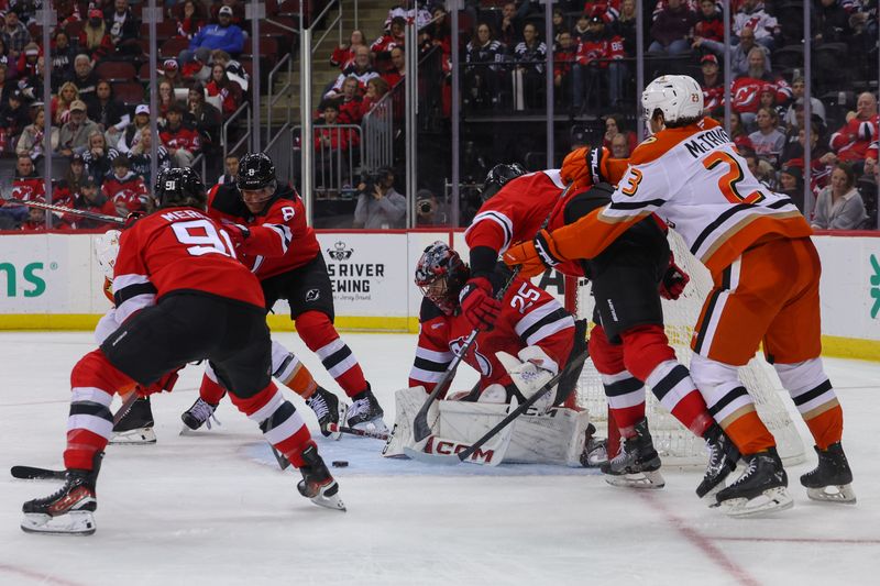 Oct 27, 2024; Newark, New Jersey, USA; New Jersey Devils goaltender Jacob Markstrom (25) makes a save against the Anaheim Ducks during the third period at Prudential Center. Mandatory Credit: Ed Mulholland-Imagn Images