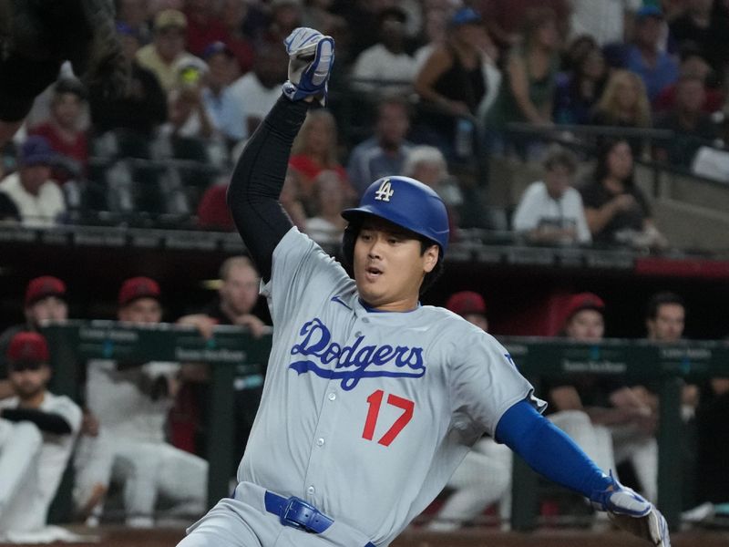 Sep 24, 2025; Phoenix, Arizona, USA; Los Angeles Dodgers two-way player Shohei Ohtani (17) scores a run against the Arizona Diamondbacks in the first inning at Chase Field. Mandatory Credit: Rick Scuteri-Imagn Images