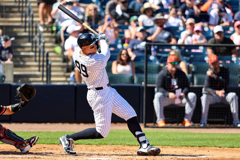 Feb 21, 2026; Tampa, Florida, USA; New York Yankees outfielder Aaron Judge (99) hits a home run against the Detroit Tigers during the third inning in a Spring Training game at George M. Steinbrenner Field. Mandatory Credit: Morgan Tencza-Imagn Images