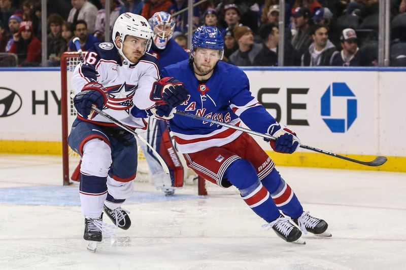 Nov 12, 2023; New York, New York, USA; Columbus Blue Jackets center Jack Roslovic (96) and New York Rangers defenseman Zac Jones (6) collide in the second period at Madison Square Garden. Mandatory Credit: Wendell Cruz-USA TODAY Sports