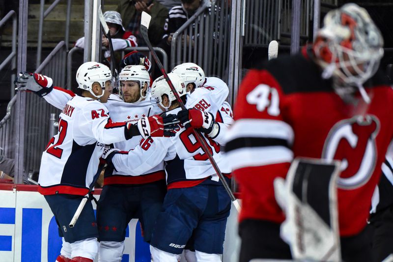 Nov 10, 2023; Newark, New Jersey, USA; Washington Capitals left wing Beck Malenstyn (47) celebrates with teammates after scoring a goal against the New Jersey Devils during the first period at Prudential Center. Mandatory Credit: John Jones-USA TODAY Sports