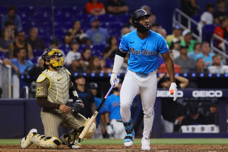 Aug 11, 2024; Miami, Florida, USA; Miami Marlins right fielder Jesus Sanchez (12) looks on after hitting a two-run home run against the San Diego Padres during the seventh inning at loanDepot Park. Mandatory Credit: Sam Navarro-USA TODAY Sports