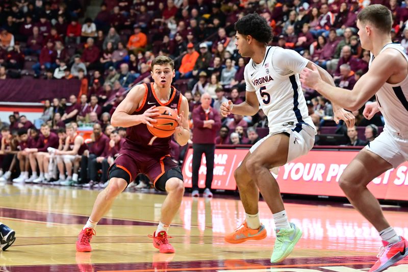 Feb 15, 2025; Blacksburg, Virginia, USA; Virginia Tech Hokies guard Brandon Rechsteiner (7) controls the ball as Virginia Cavaliers forward Jacob Cofie (5) defends during the first half at Cassell Coliseum. Mandatory Credit: Brian Bishop-Imagn Images