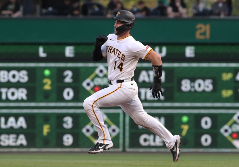 Apr 30, 2025; Pittsburgh, Pennsylvania, USA;  Pittsburgh Pirates catcher Joey Bart (14) runs to second base with a double against the Chicago Cubs during the fourth inning at PNC Park. Mandatory Credit: Charles LeClaire-Imagn Images