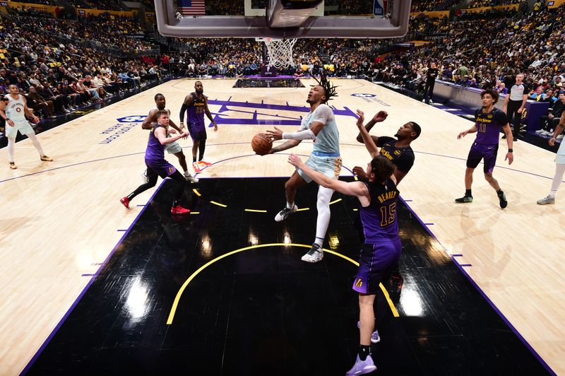 LOS ANGELES, CA - JANUARY 13: Stephon Castle #5 of the San Antonio Spurs drives to the basket during the game against the Los Angeles Lakers on January 13, 2025 at Crypto.Com Arena in Los Angeles, California. NOTE TO USER: User expressly acknowledges and agrees that, by downloading and/or using this Photograph, user is consenting to the terms and conditions of the Getty Images License Agreement. Mandatory Copyright Notice: Copyright 2025 NBAE (Photo by Adam Pantozzi/NBAE via Getty Images)